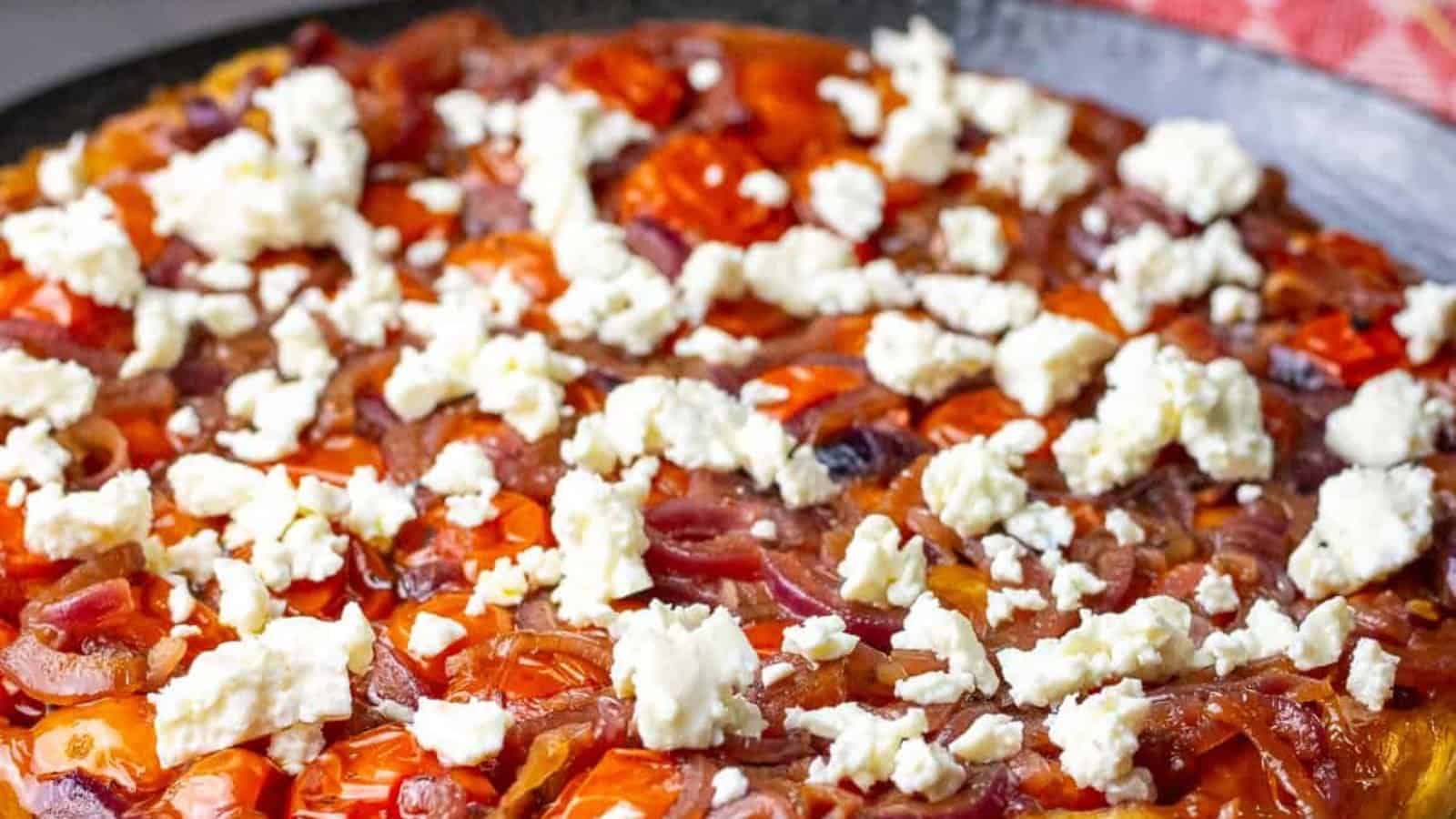 Savory cherry tomato tarte Tatin baked with a golden crust.