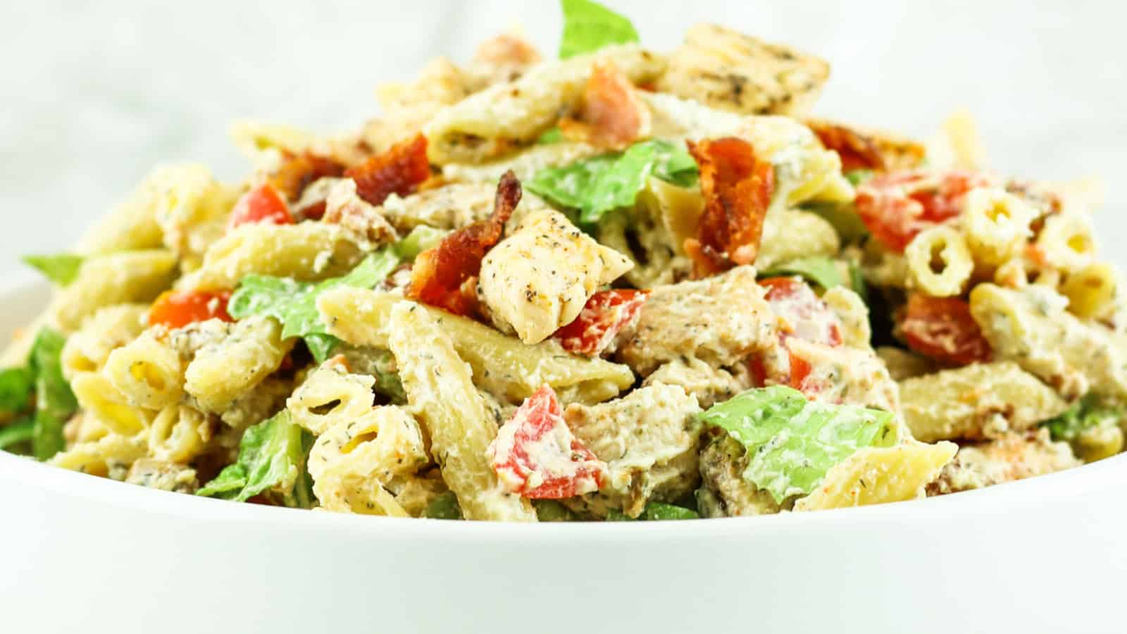 Ranch pasta salad with cottage cheese, vegetables, and tender pasta.