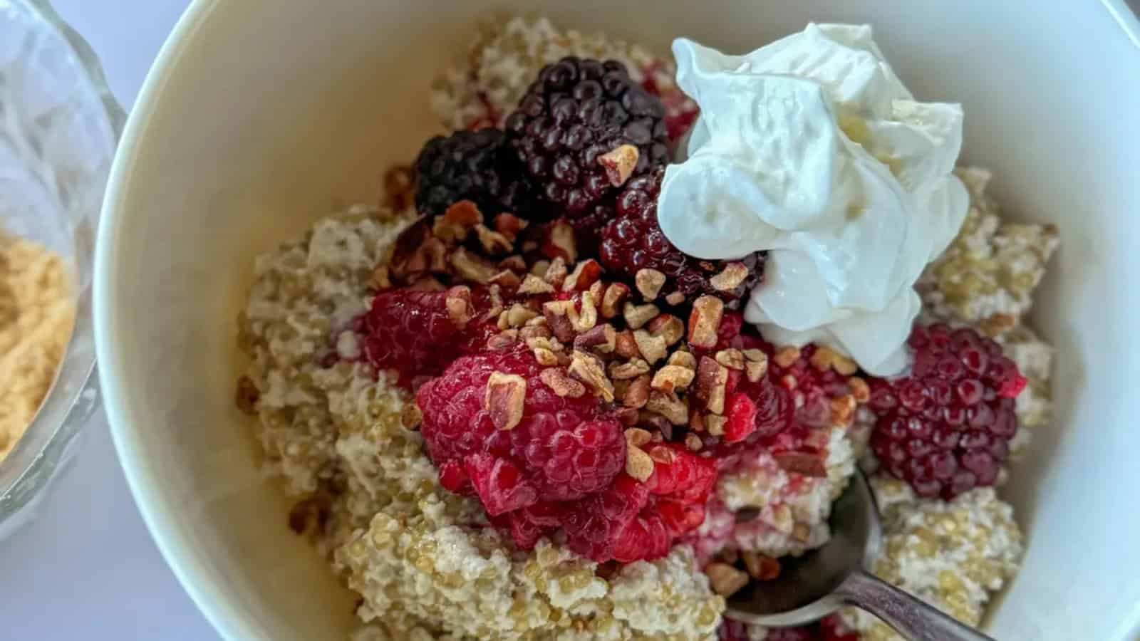 Quinoa breakfast bowl made with coconut milk and fresh toppings.