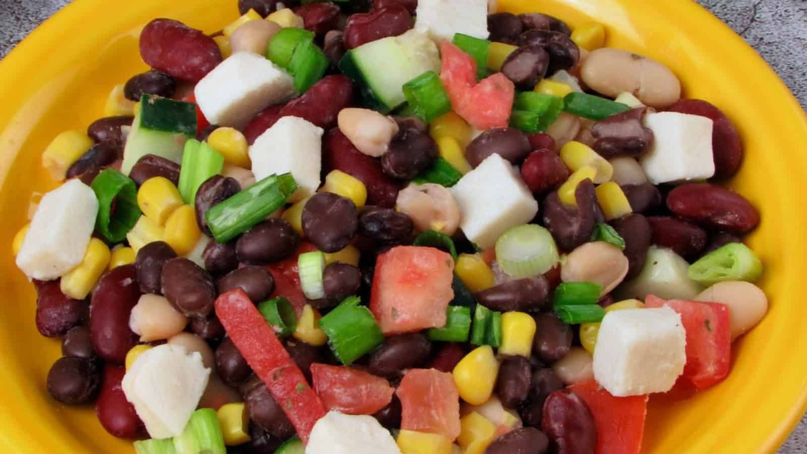Vegan three bean salad tossed in a sweet and tangy vinaigrette.