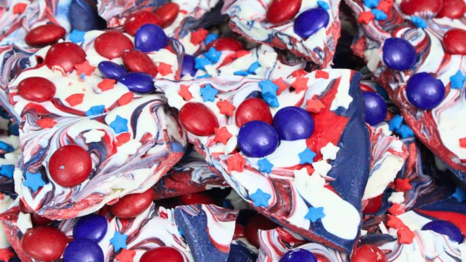 Chocolate bark topped with festive red, white, and blue candies.