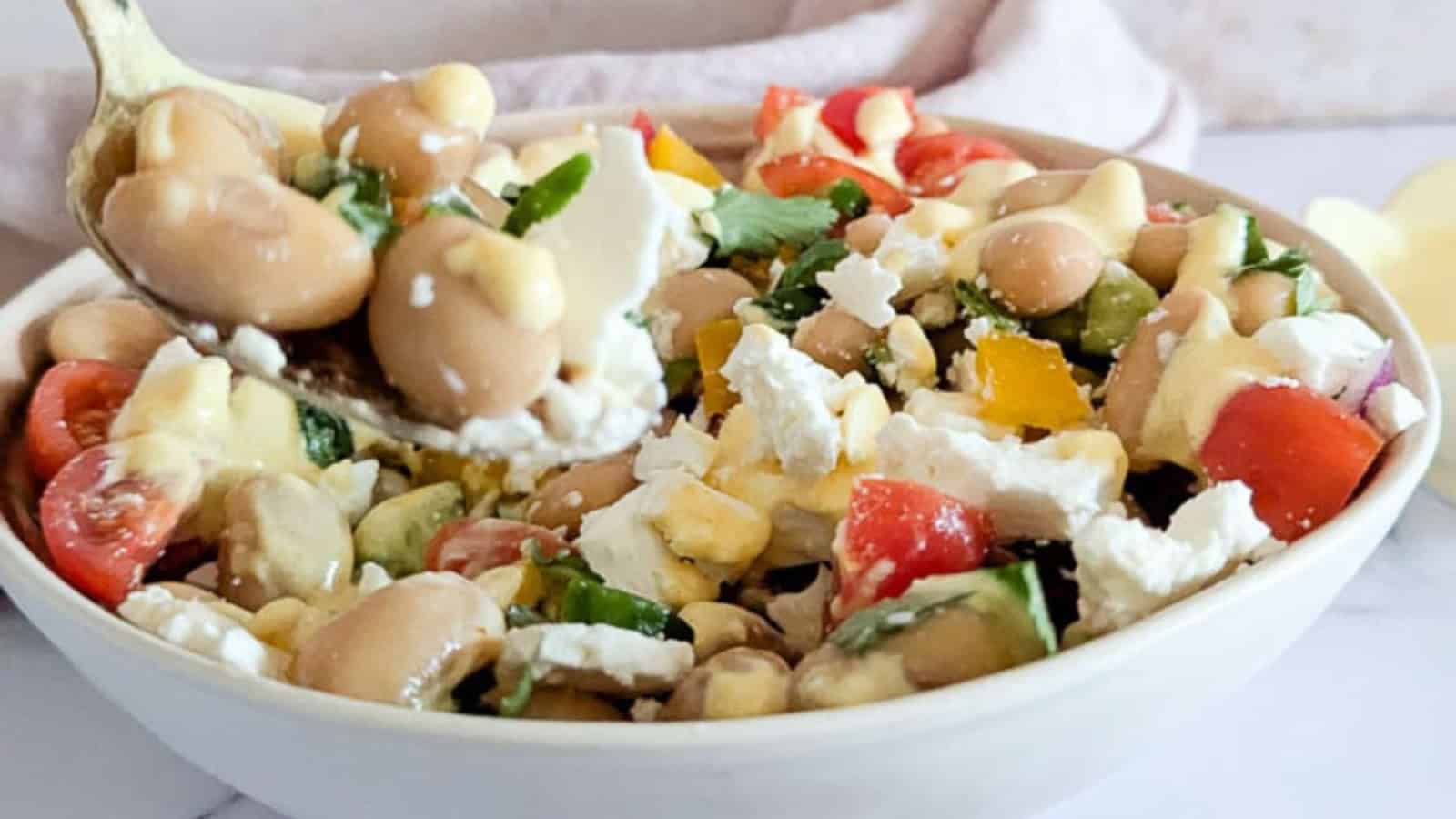 Butter bean salad with fresh vegetables and a protein-rich dressing.