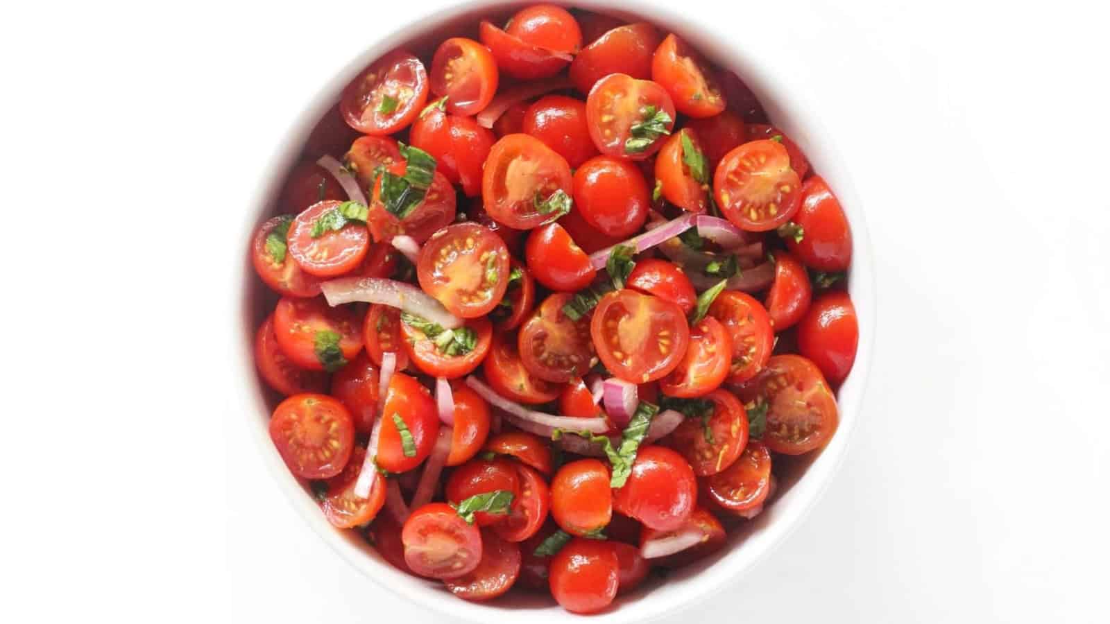 Fresh tomato salad tossed with herbs and a light vinaigrette.