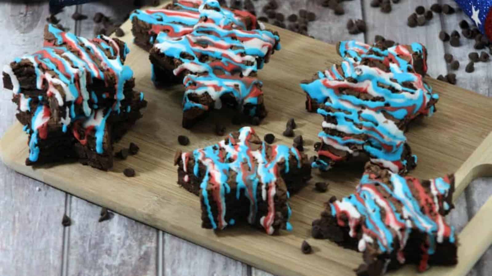 Fudgy brownies decorated with patriotic frosting and colorful toppings.