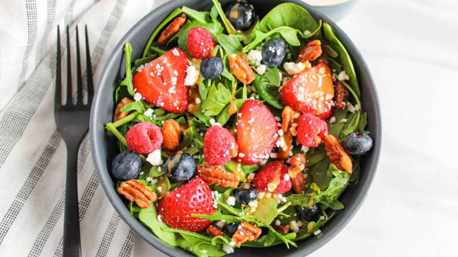 Fresh mixed berry salad filled with strawberries, blueberries, and blackberries.