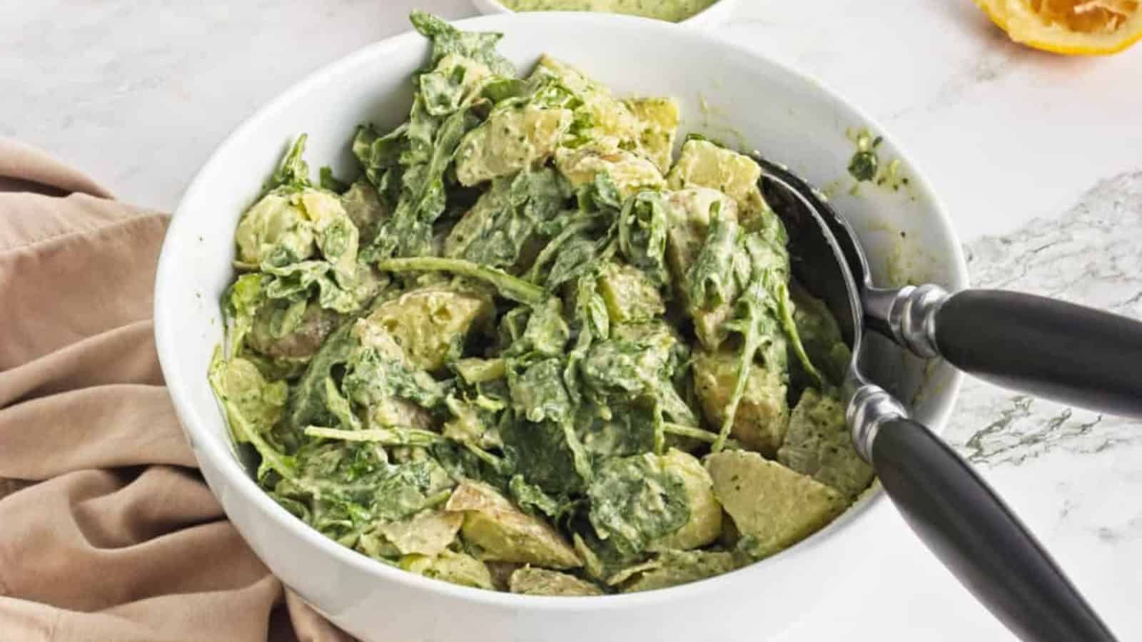 Potato salad coated in a creamy tahini dressing with fresh herbs.