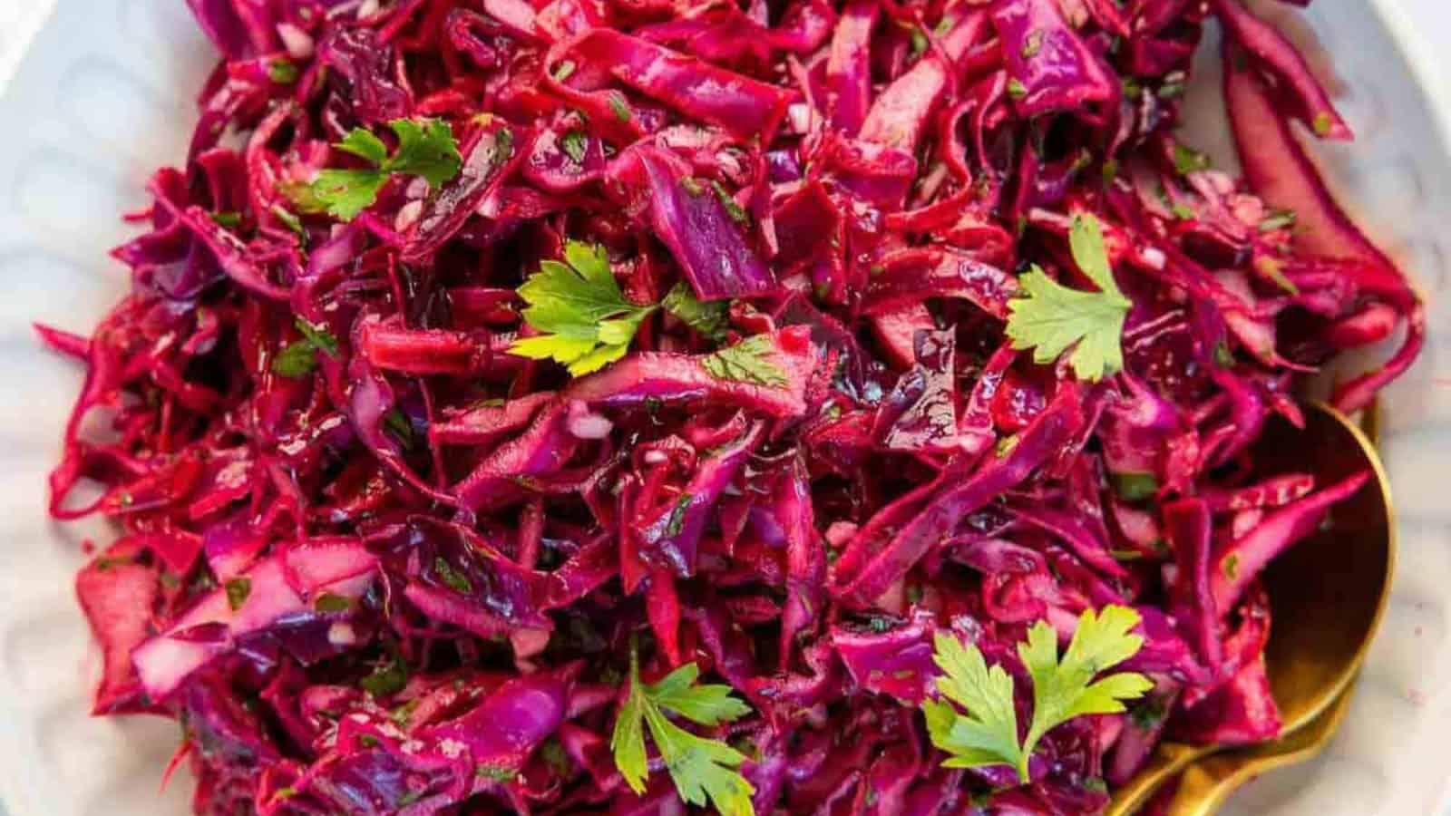 Crunchy red cabbage slaw mixed with a simple and flavorful dressing.