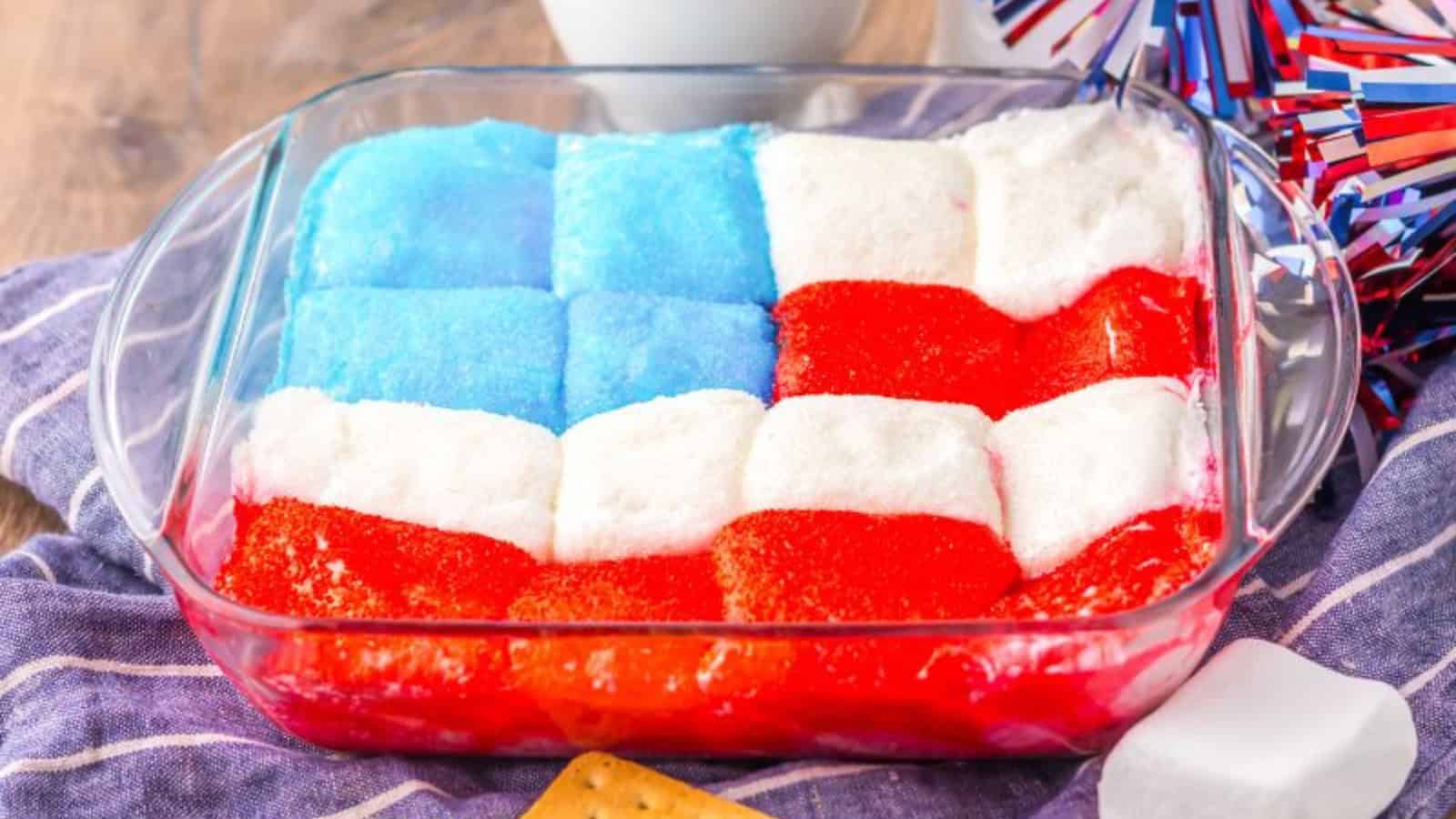 S&rsquo;mores dip topped with patriotic candies and melted marshmallows.