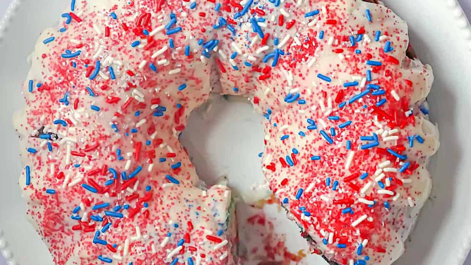 Bundt cake featuring festive red, white, and blue colors throughout.