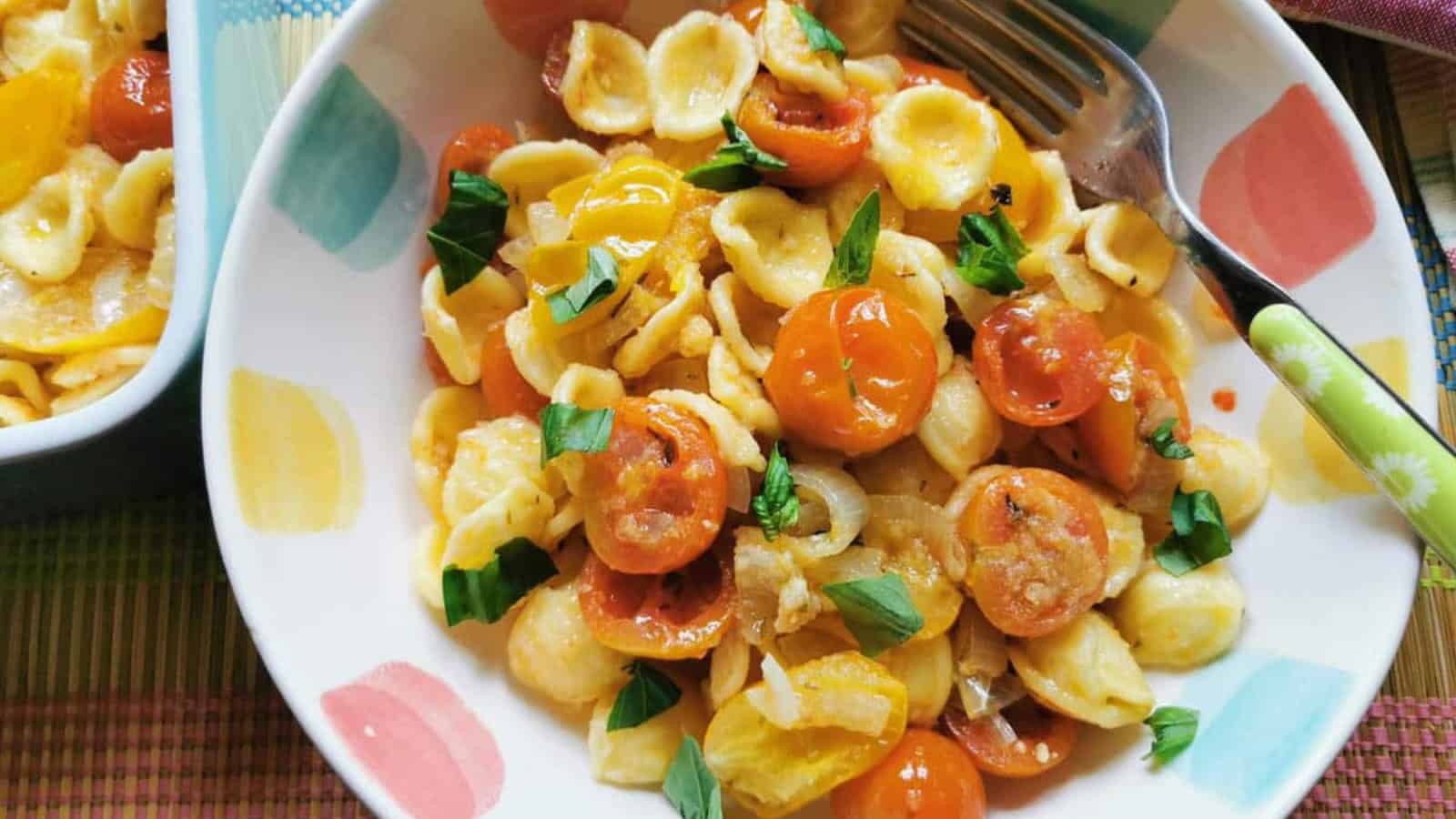 Orecchiette pasta mixed with roasted tomatoes and savory seasonings.