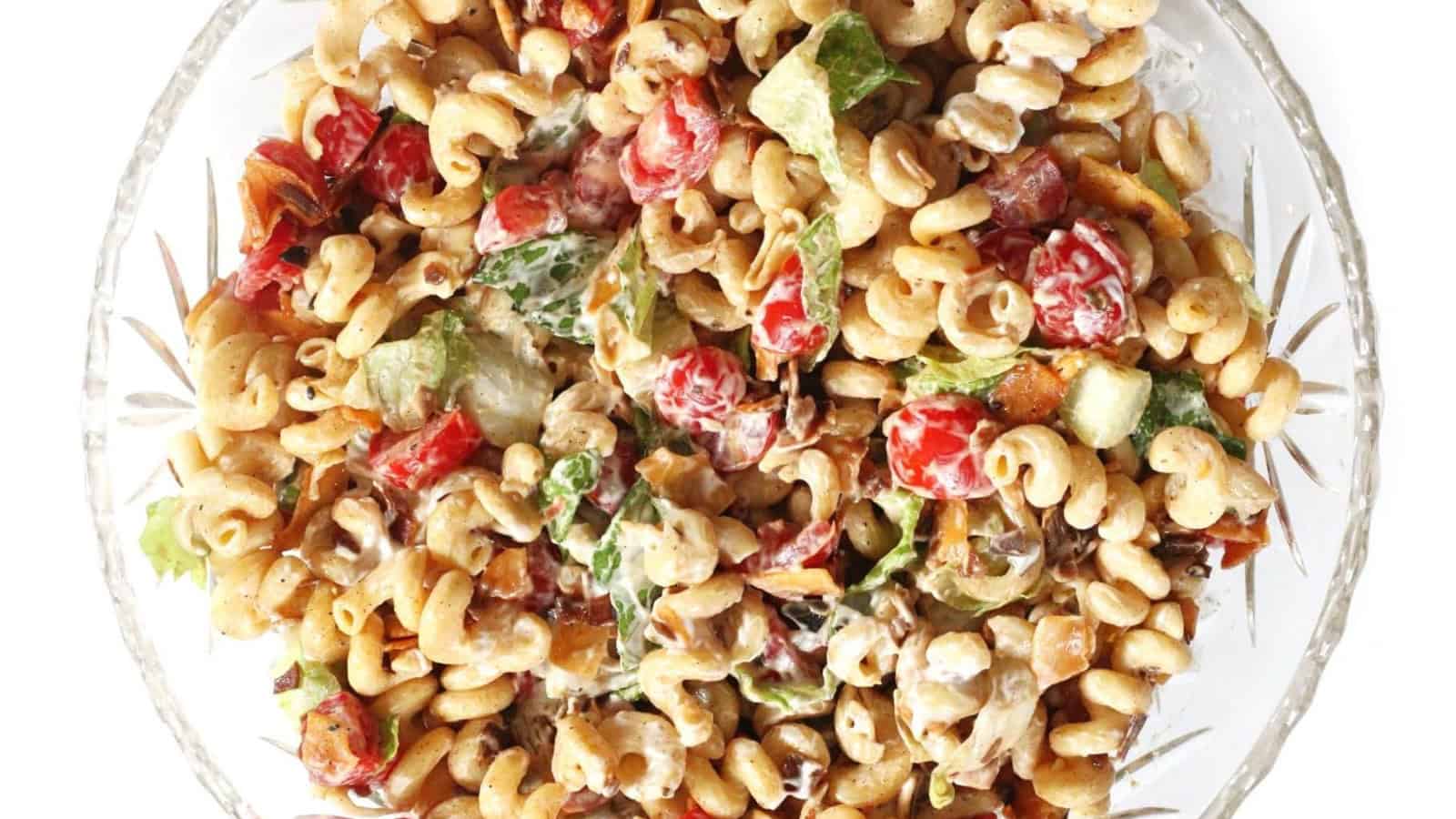 Vegan BLT pasta salad with tomatoes, lettuce, and smoky plant-based ingredients.