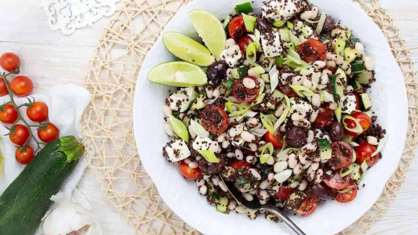 Mediterranean bean salad with zucchini, tomatoes, and fresh herbs.