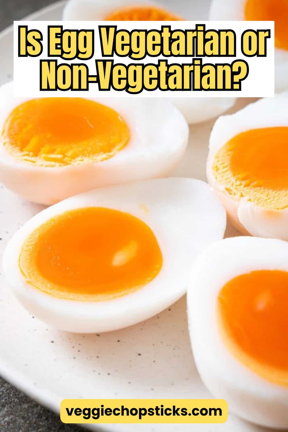 Soft-boiled eggs with orange yolks sliced in half and arranged on a plate.