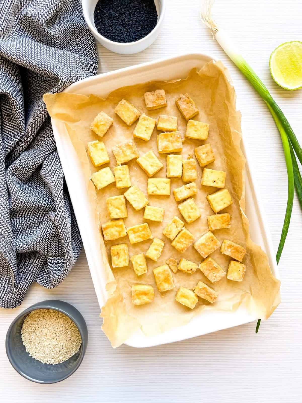 Golden baked tofu cubes with crispy edges fresh from the oven.