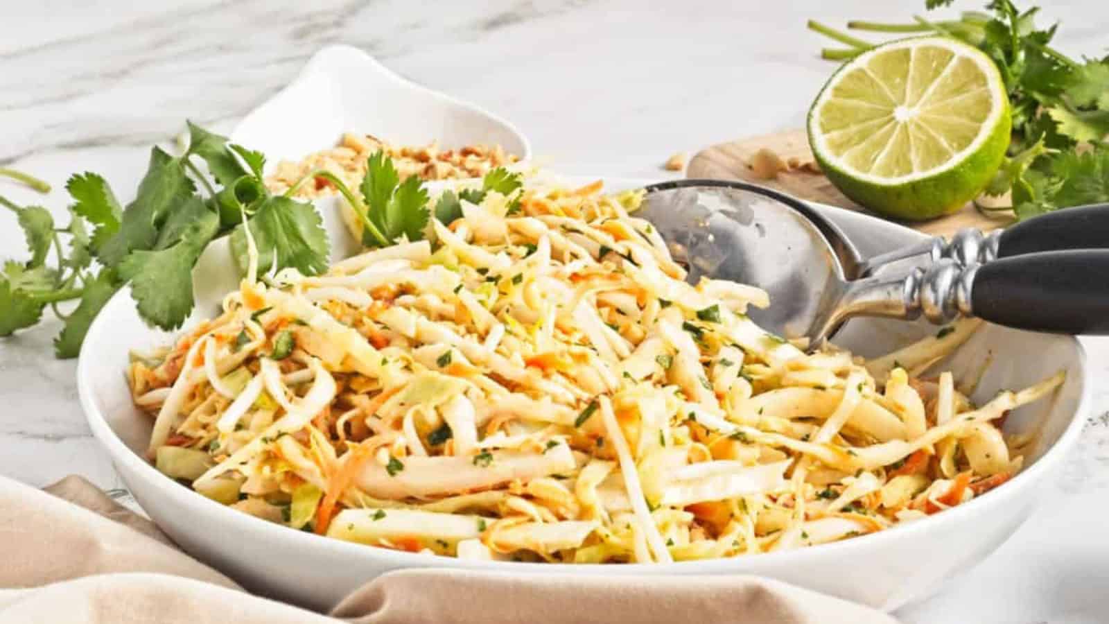 Colorful Asian slaw coated in a creamy peanut dressing.