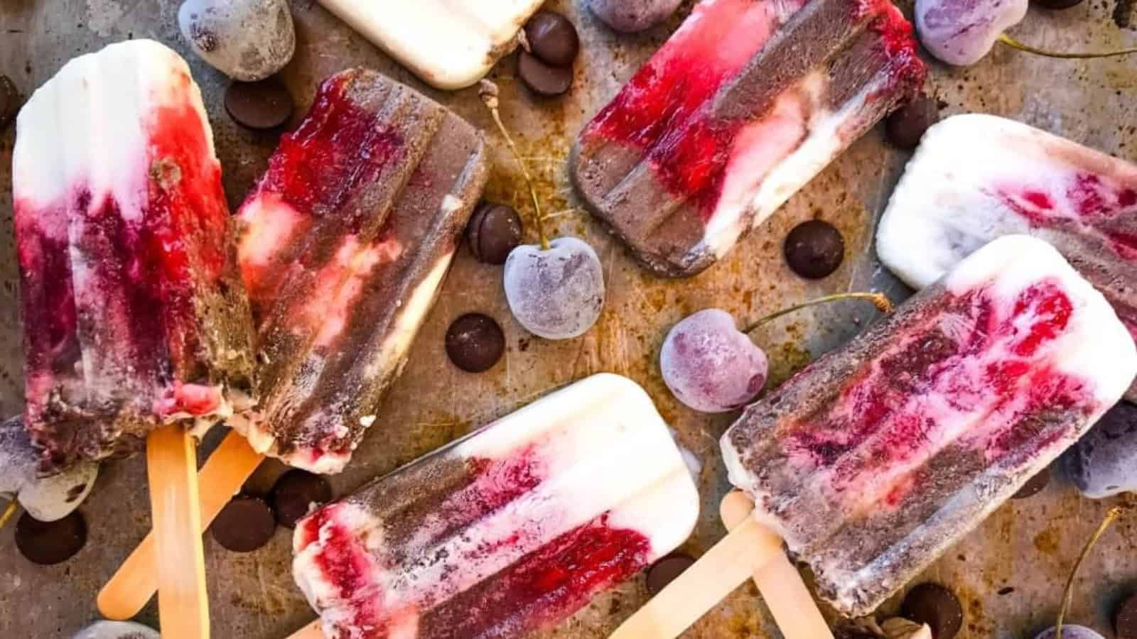 Creamy Black Forest yogurt popsicles with cherries and chocolate.