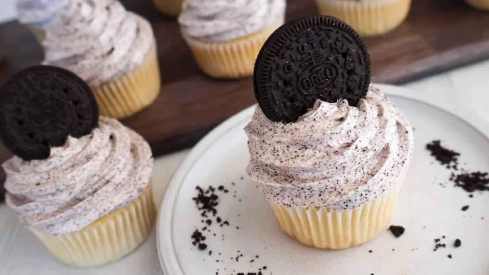 Dairy-free vanilla cupcakes topped with smooth vanilla frosting.