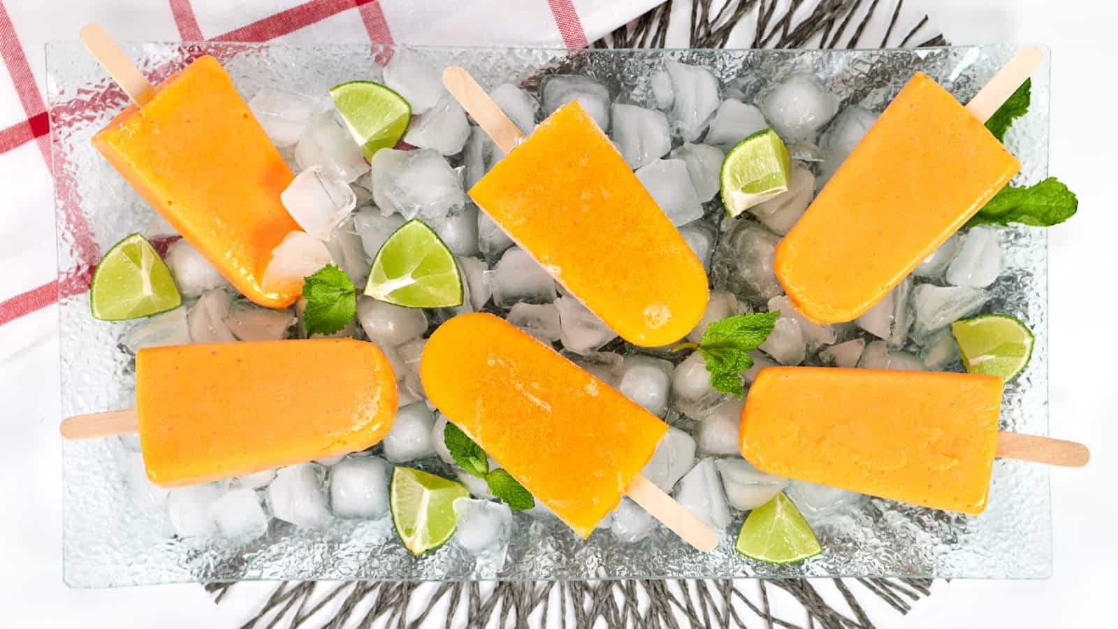 Sweet mango popsicles frozen into a refreshing treat.