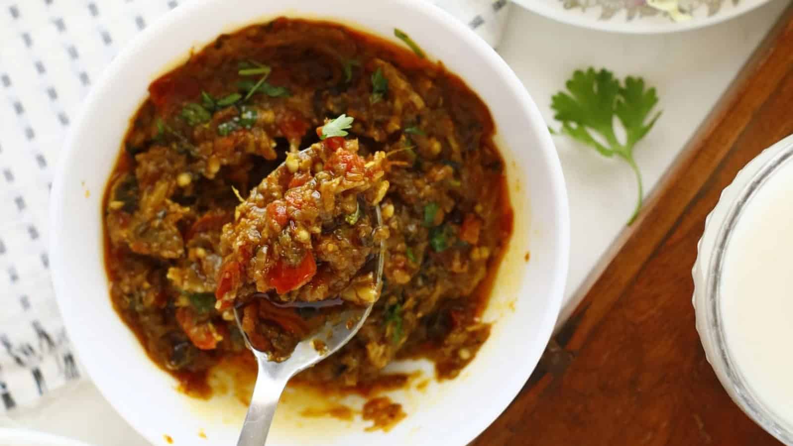 Smoky mashed eggplant cooked with tomatoes, onions, and spices.