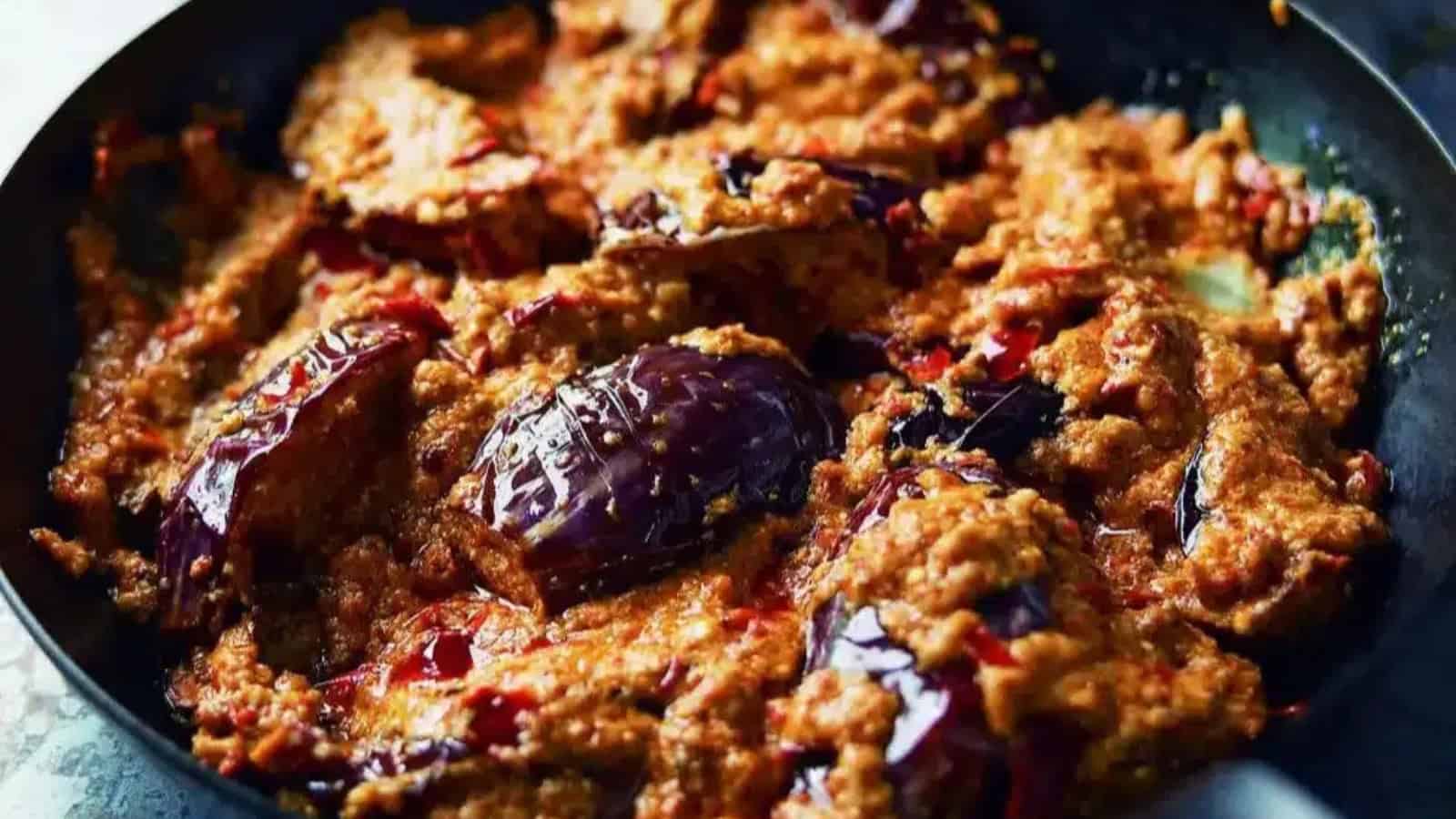 Eggplant cooked in a rich and tangy mustard gravy.