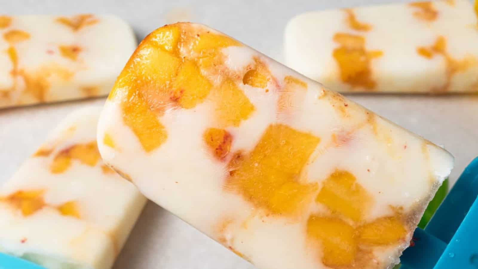 Creamy peaches and yogurt popsicles sweetened with honey.