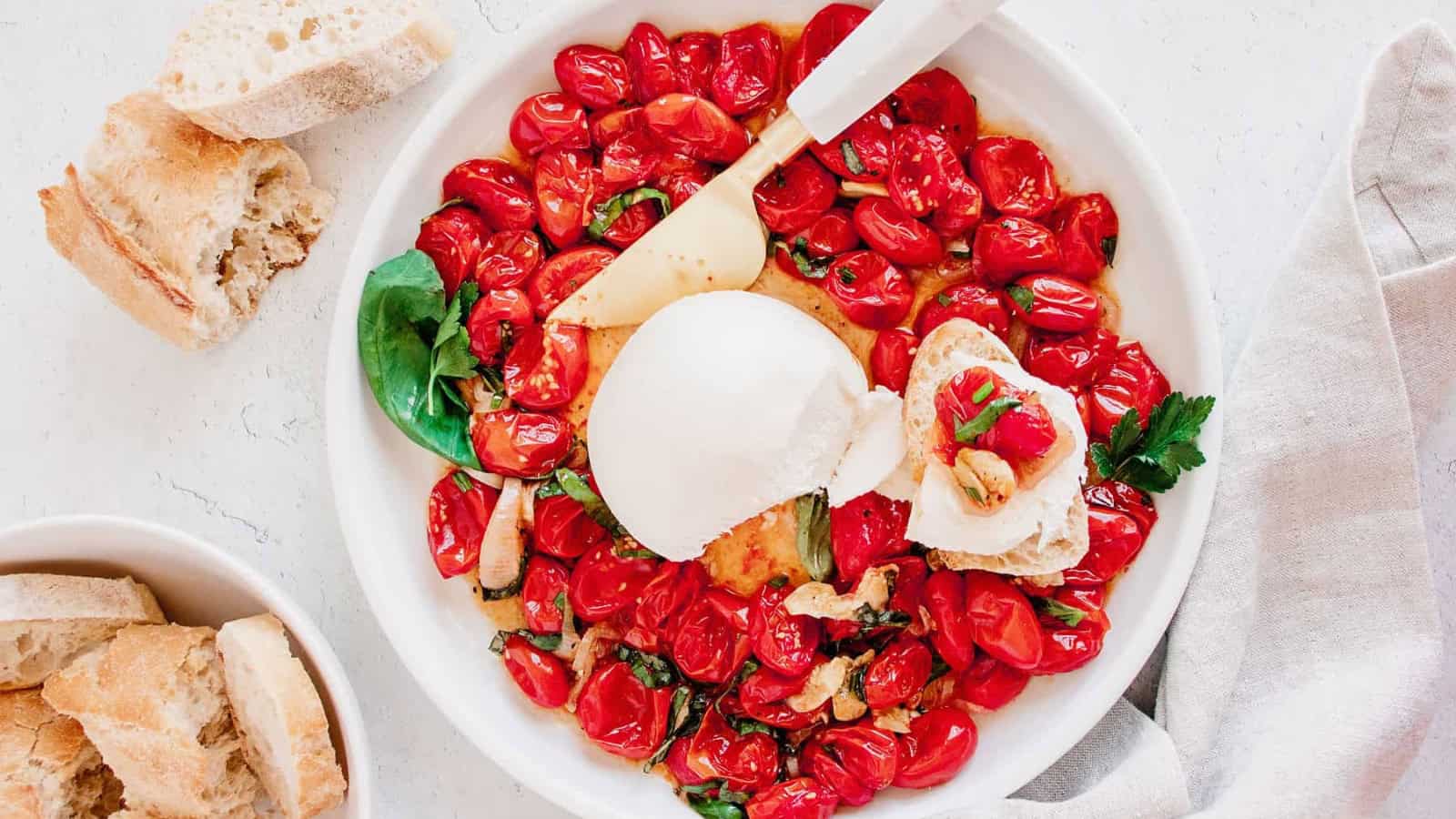 Tomato mozzarella appetizer layered with fresh basil.