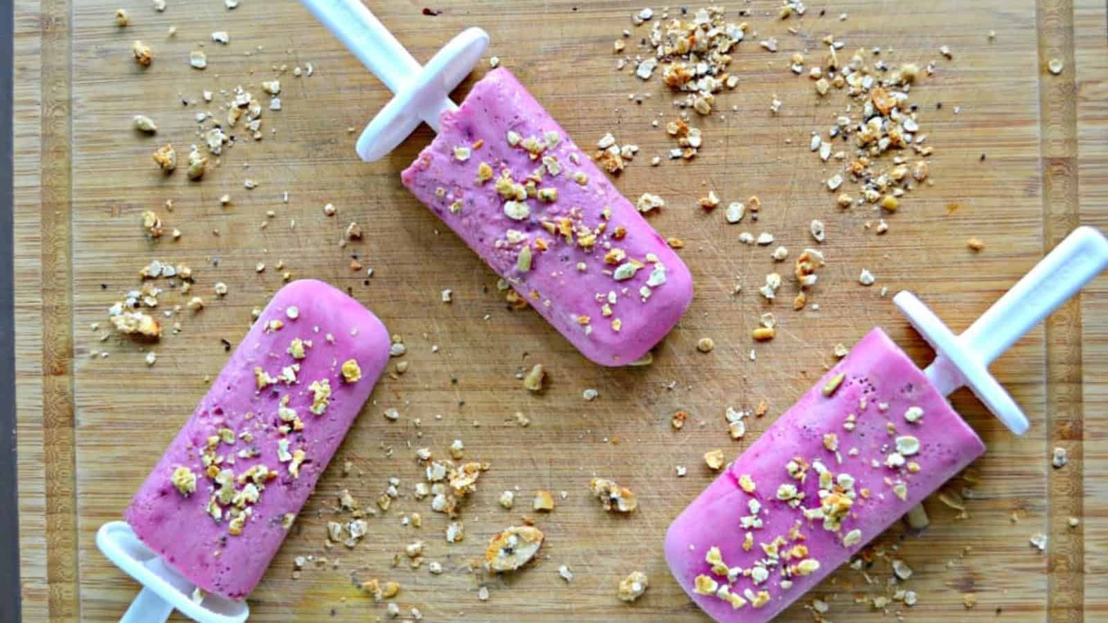 Strawberry breakfast popsicles made with fruit and yogurt.