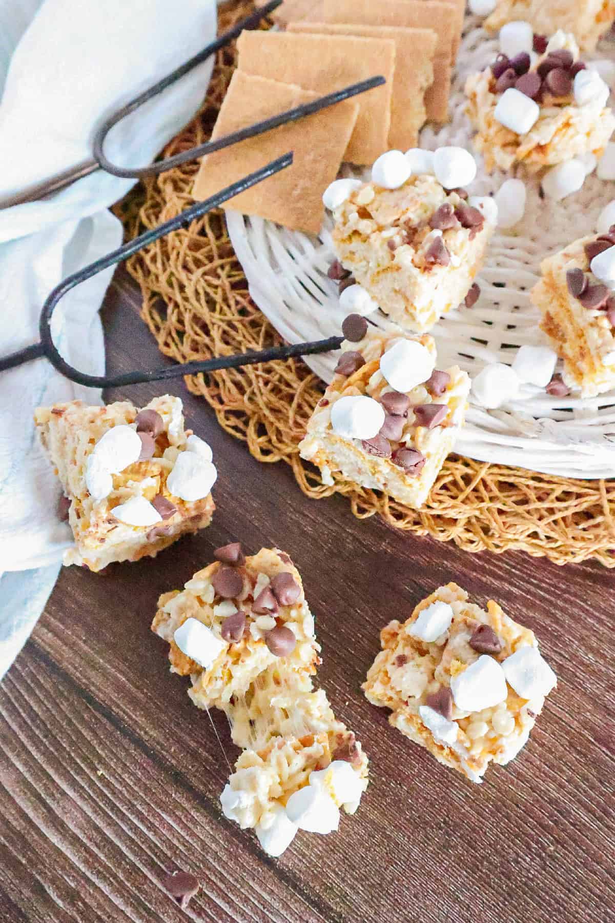 S'mores Rice Krispie treats served with graham crackers, chocolate chips, and mini marshmallows.