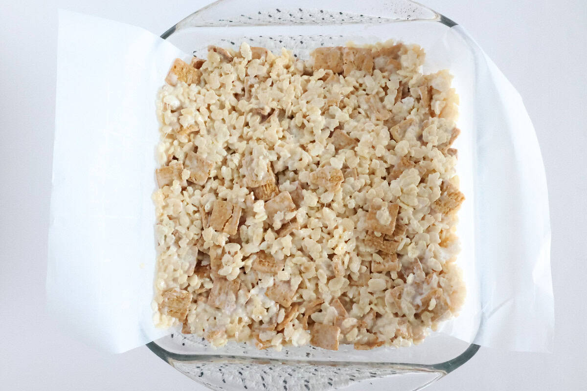 S'mores Rice Krispie treat mixture pressed evenly into a baking dish.