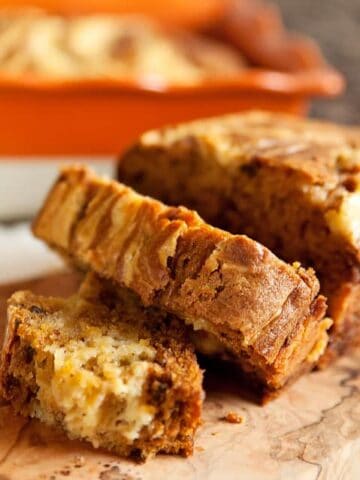 Pumpkin pecan bread topped with a creamy orange mascarpone swirl.