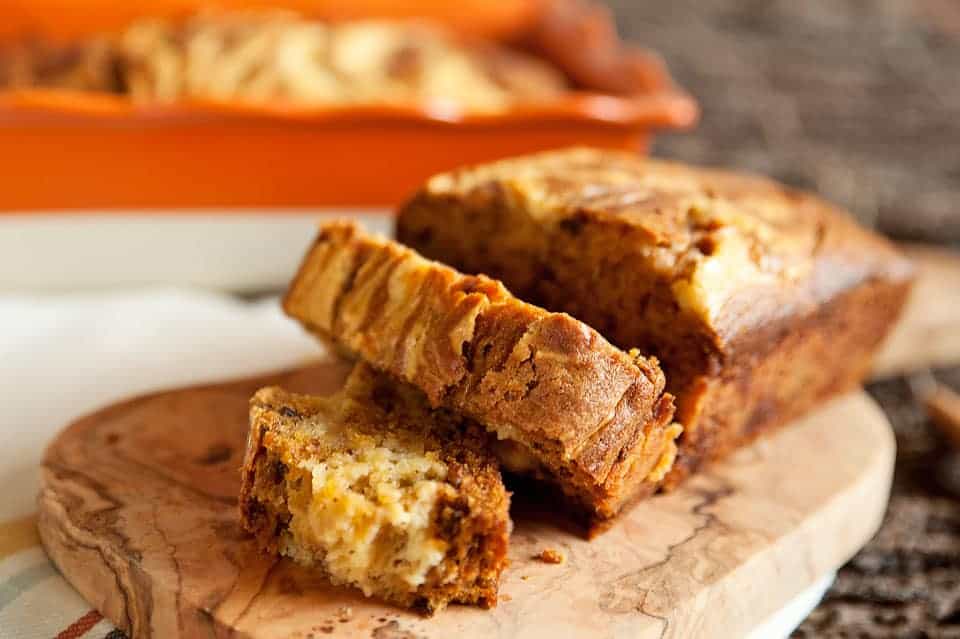 Pumpkin pecan bread topped with a creamy orange mascarpone swirl.