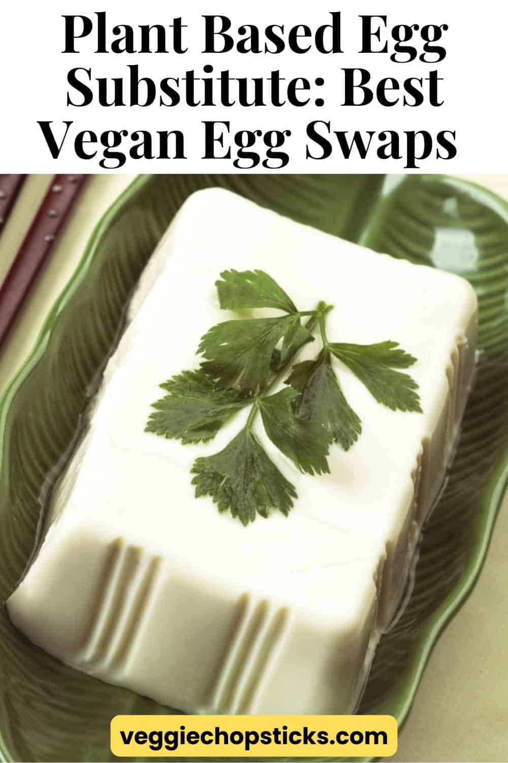 A block of tofu topped with fresh parsley on a green serving plate.