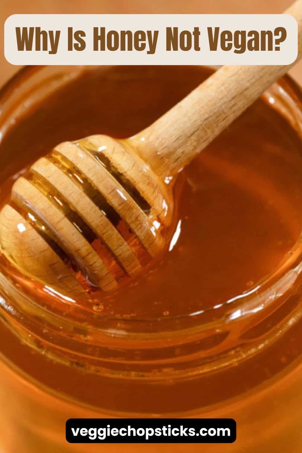 A wooden honey dipper dripping golden honey into a glass jar.