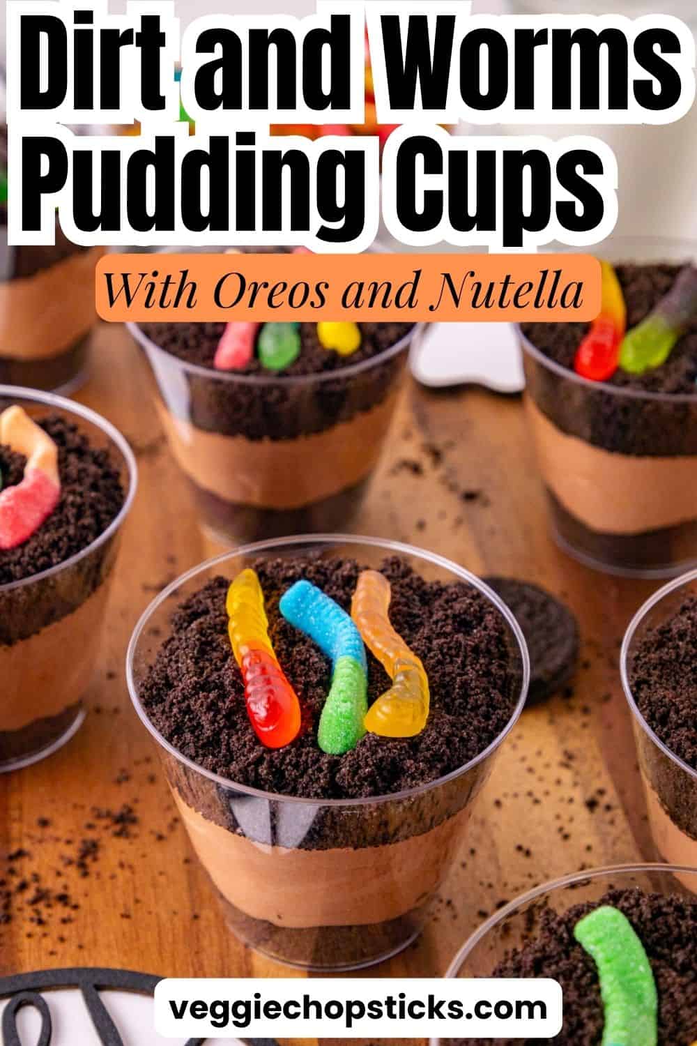 Dirt and worms pudding cups made with chocolate pudding, Nutella, Oreo crumbs, and gummy worms.
